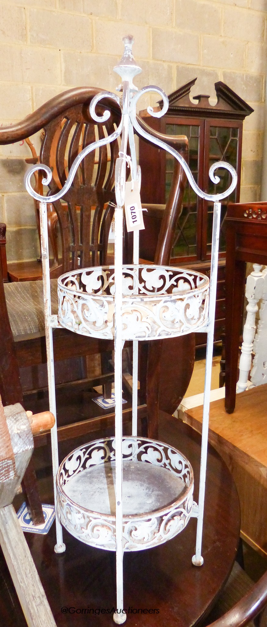 A painted metal two tier stand, height 96cm